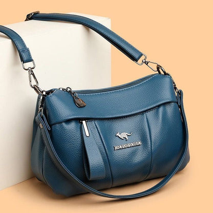 Bolso bandolera de piel suave con logotipo