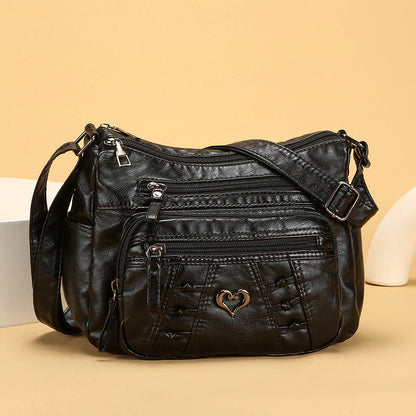 Bolso de piel práctico e informal con múltiples bolsillos
